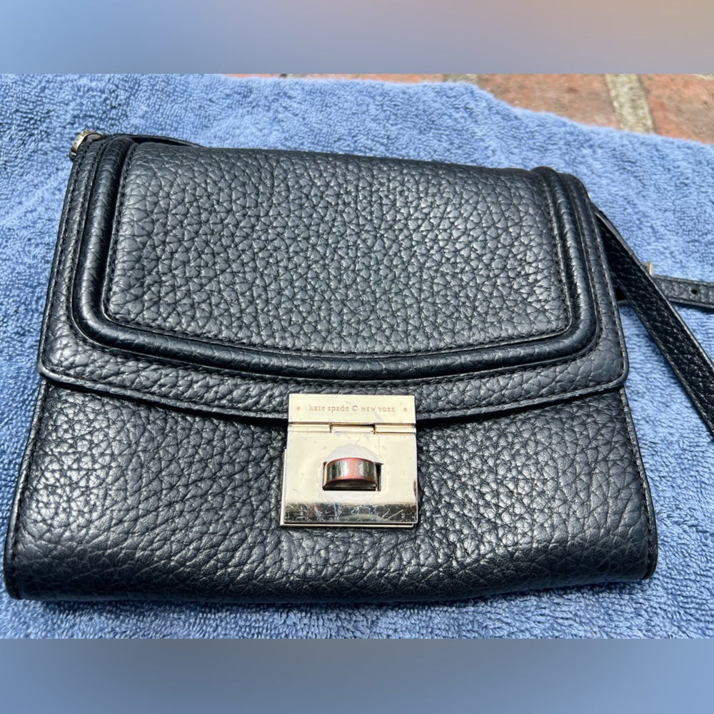 Kate spade leather purse with buckle closure